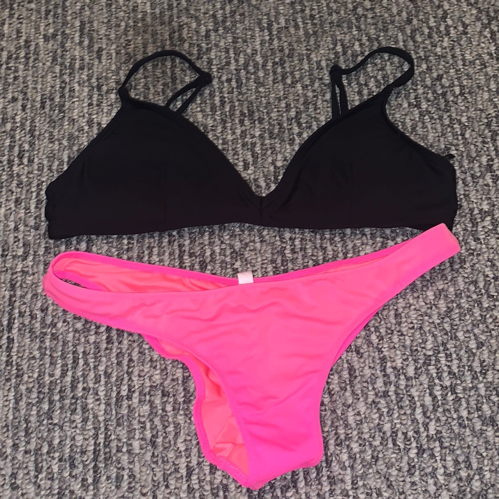 Black bikini top and neon pink bikini bottom